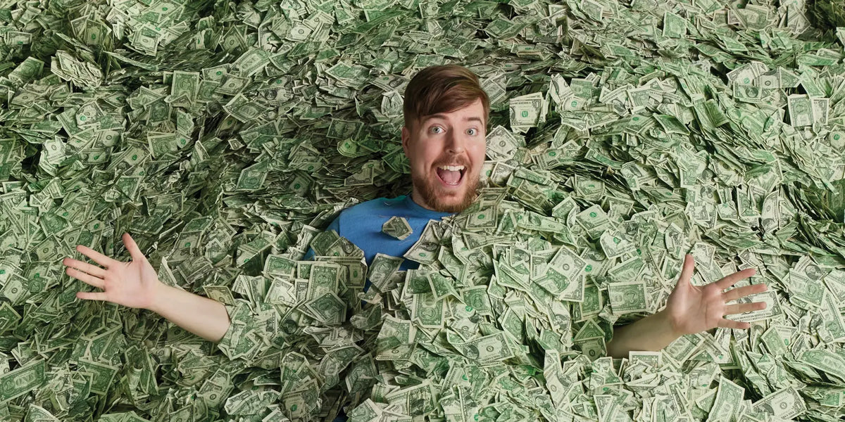 Video creator smiling while surrounded by piles of dollar bills