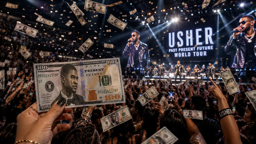 Fan holding custom Usher concert prop money while branded bills float through a packed arena crowd during a live world tour performance.