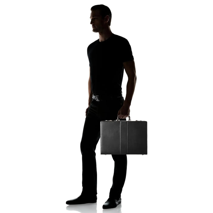 Person carrying the closed black briefcase to show its size
