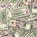 $5 New Series Close-Up prop bills with printed fronts and backs scattered randomly; one complete front and back centered.